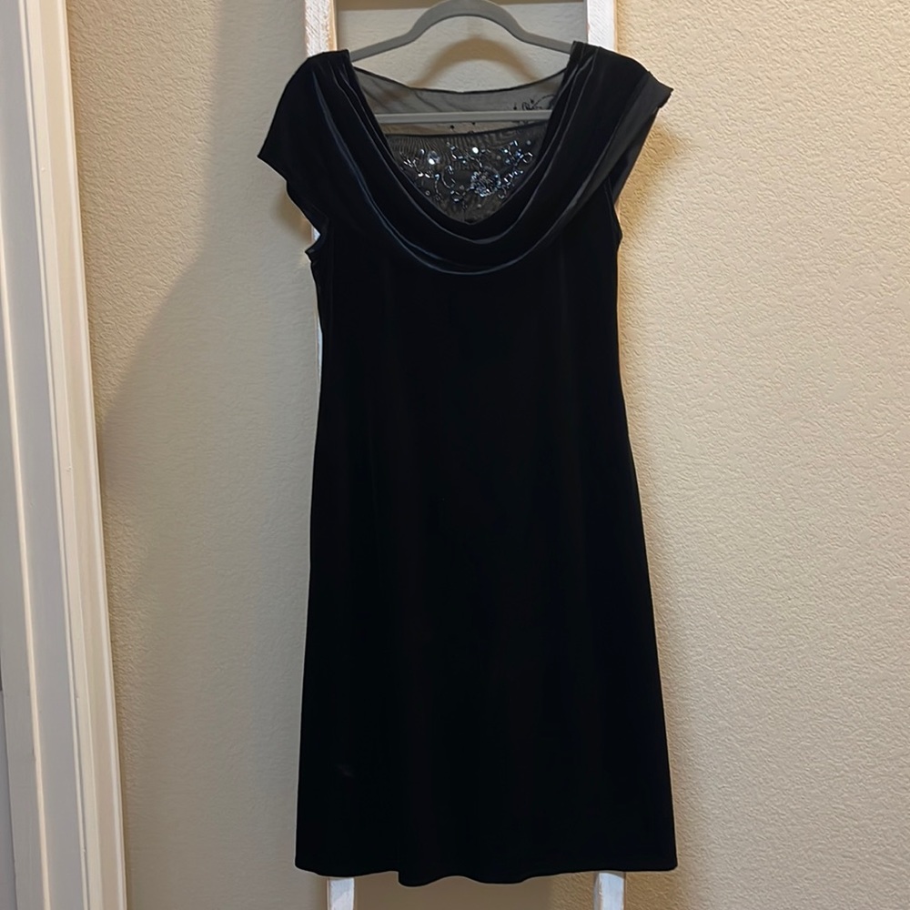 Black party dress with drape collar and beaded net inserts front and drop back